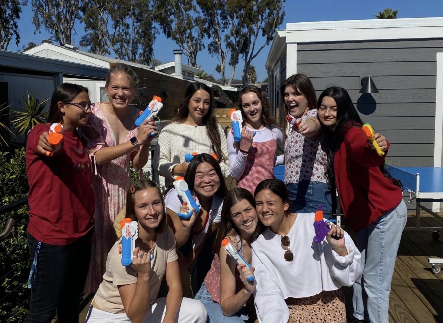 A group of seniors pose with their guns on the first day of Senior Assassins. The game was cut short last week due to COVID-19 concerns, the first year without a winner. 