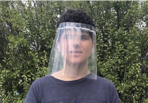 Kyle Vallone (11), a student at Tesoro High School, donates face shields to those in need through CAPO CARES.
