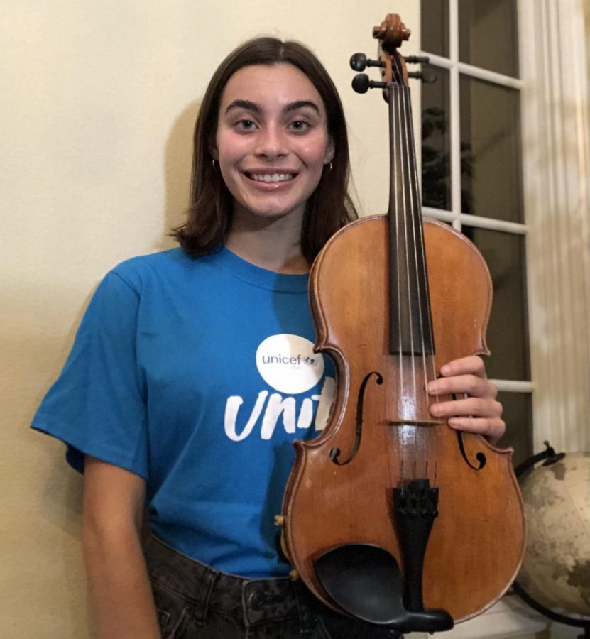 Olivia Ross (12) poses with the instrument she will be performing with in the virtual concert that will take placer Friday October 23.  