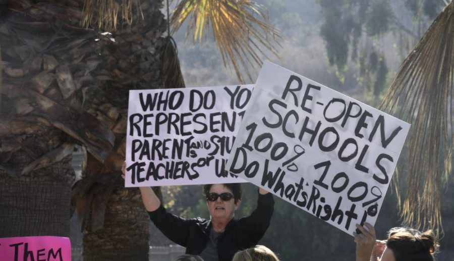 Parents+from+across+CUSD+gather+in+front+of+the+school+district+office+building+to+protest+against+agenda+item+38%2C+a+proposal+to+reopen+schools+at+the+start+of+the+second+semester.+The+agenda+item+was+pulled+later+that+same+day.