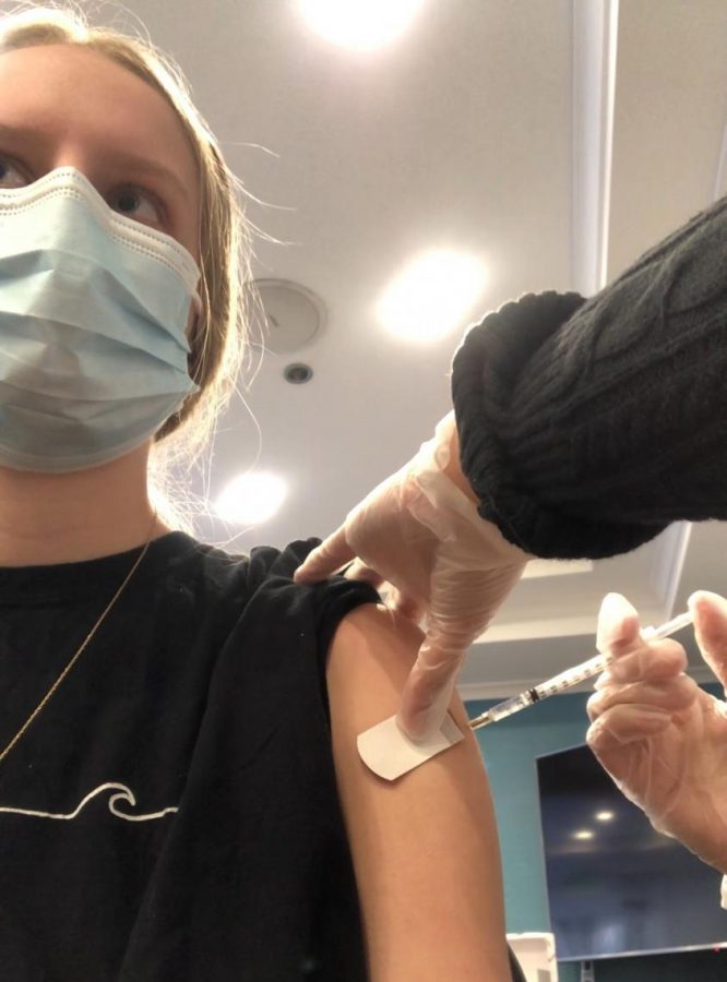 Senior Anna Carlson recently received her first dose of the Pfizer COVID-19 vaccine. As a server at the Heritage Point living facility, she took the vaccination to keep the residents and her family safe.