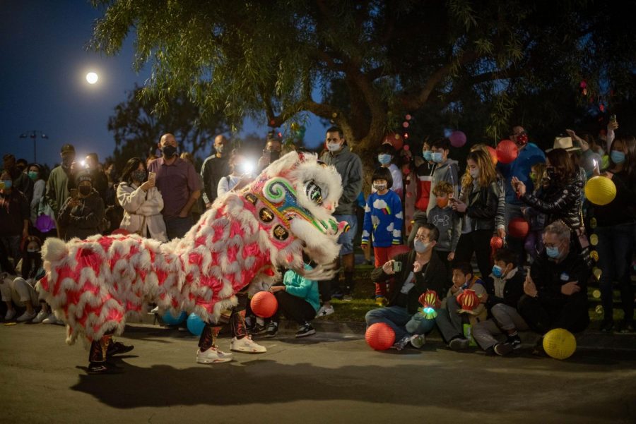 The Chinese lion interacts with audience members. Dancers entertained children and adults as onlookers were amazed by the colorful Asian culture.