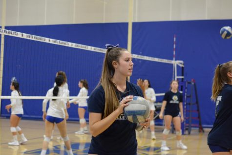 Cat Conlisk (12), practices with teammates at an away game against Santa Margarita high school. Just weeks ago, Conlisk committed to Seattle University, where she will continue pursuing volleyball with a brand new group of players.