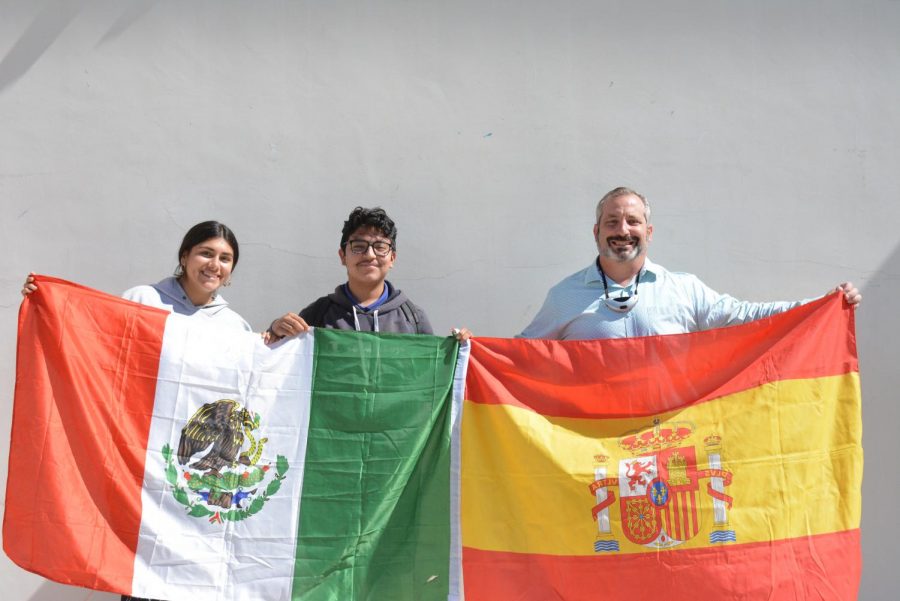 Sophia Bojorquez (12), Daniel Fernandez (12), and Mr. Serrano pose with the flags of the nations to which they belong. Sophia and Daniel are Mexicanamerican and Mr. Serrano emigrated from Spain at 23 years old. 
