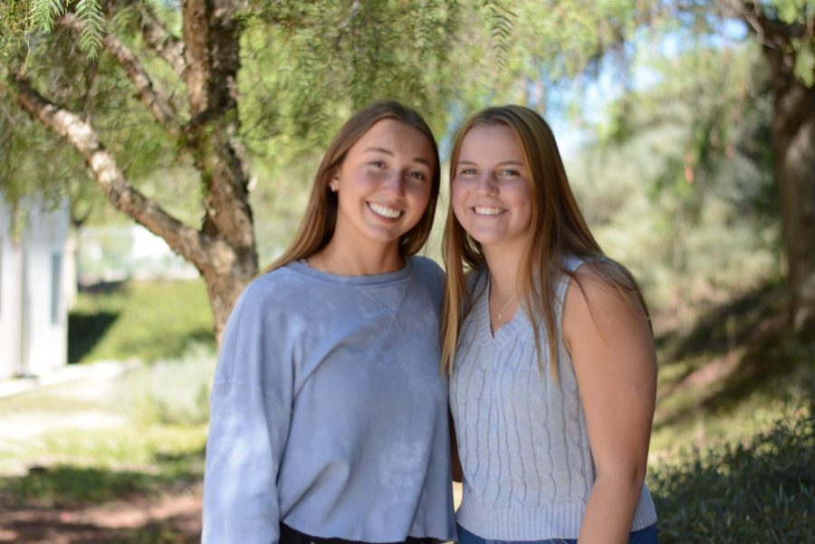  Cari Brandt (12), Young Democrats co-president and Reagan Hirchag (11), Young Republicans president, stand together despite differing political views.