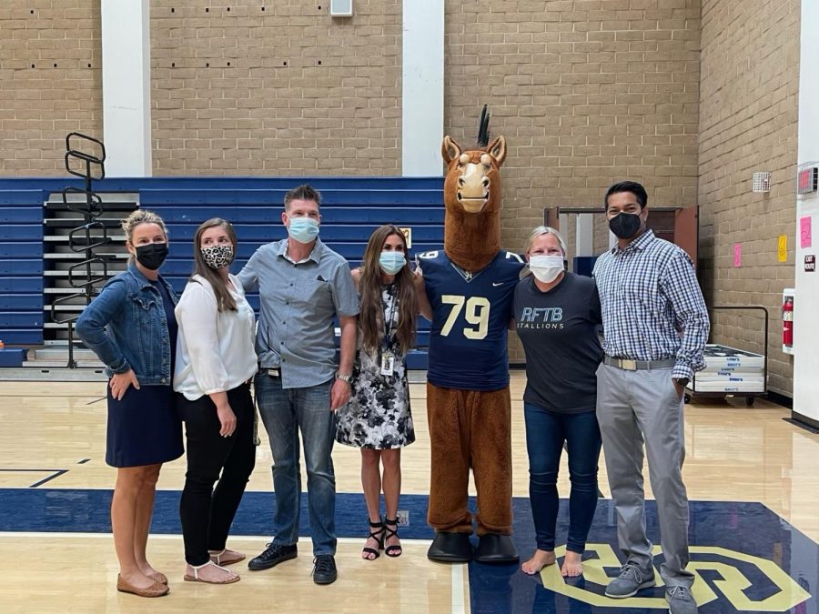 From left to right, assistant principals Amanda Bratcher, Alexandra Easton, Brian Brosamer, and Heather Bosworth smile next to Stanley the Stallion, ASB Advisor Brooke Valderrama, and principal Manoj Mahindrakar. Easton is a returning assistant principal, while the other three are new to the position. 