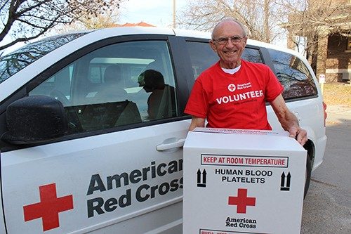 A Red Cross Member holds box of donations for hospital delivery. Each drive marks a positive turning point for many patients in need, and the October 26th drive with CUSD is no exception to that goal.