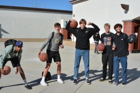 Neel Chintamaneni (10), Jack Hinrichs (10), Brody Averell (11), Fritz Melchert (11), and Jonah Lee (11) dribbling their basketballs around in-between classes.   