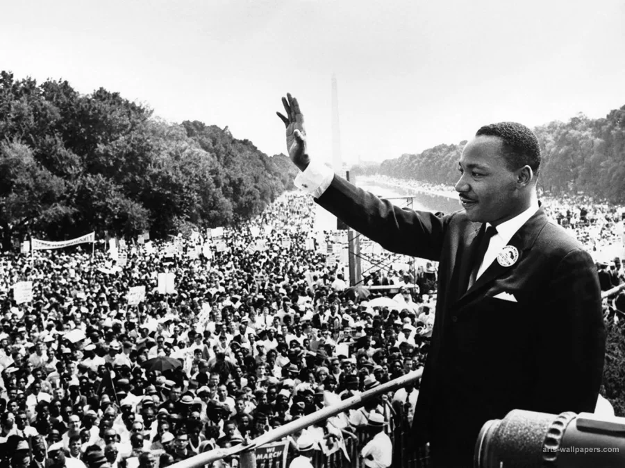 Martin Luther King Jr. waves to the crowd gathered during the March on Washington, where he gave him most famous speech I Have A Dream. 