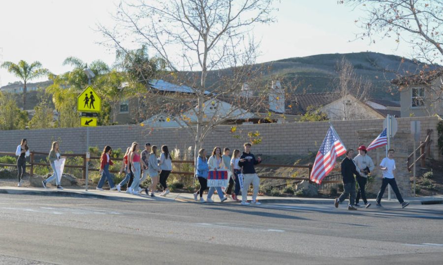Students+demonstrated+just+outside+of+school+bounds+with+signs+and+an+American+flag.+Other+demonstrations++similar+to+this+took+place+at+schools+such+as+San+Clemente+High+School+and+Ladera+Ranch+Middle+School.+