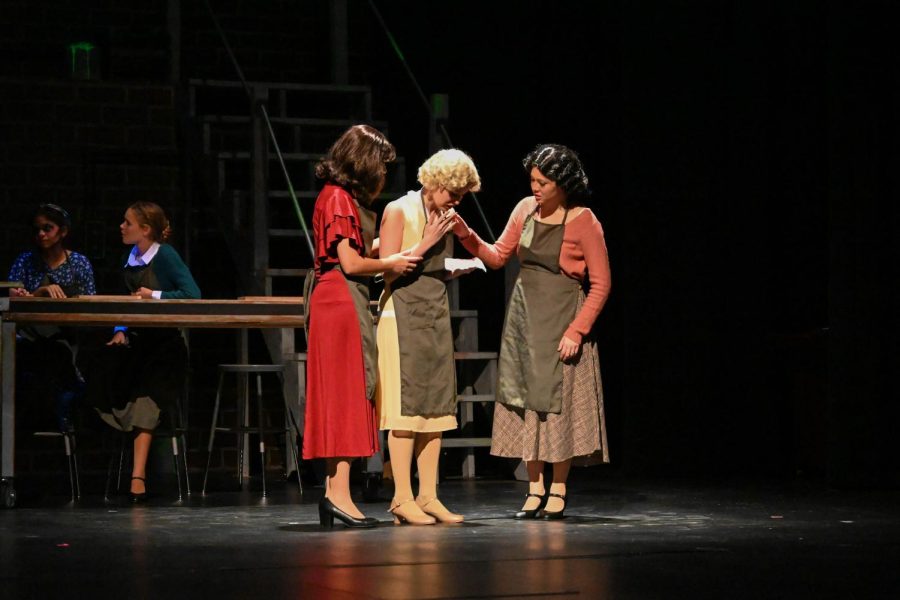 Viola Whitaker’s Kathryn Schaub, whispers a secret to Grace Freyer, portrayed by Julia Tonai (12). Radium Girls follows the story of Grace Freyer, and how she was exposed to high levels of radiation while painting clocks with radium powder. The workers would lick the tip of the paintbrush to make the tip more precise, but this also led to the women ingesting high amounts of the radioactive element, before scientists knew the dangers of radiation exposure.