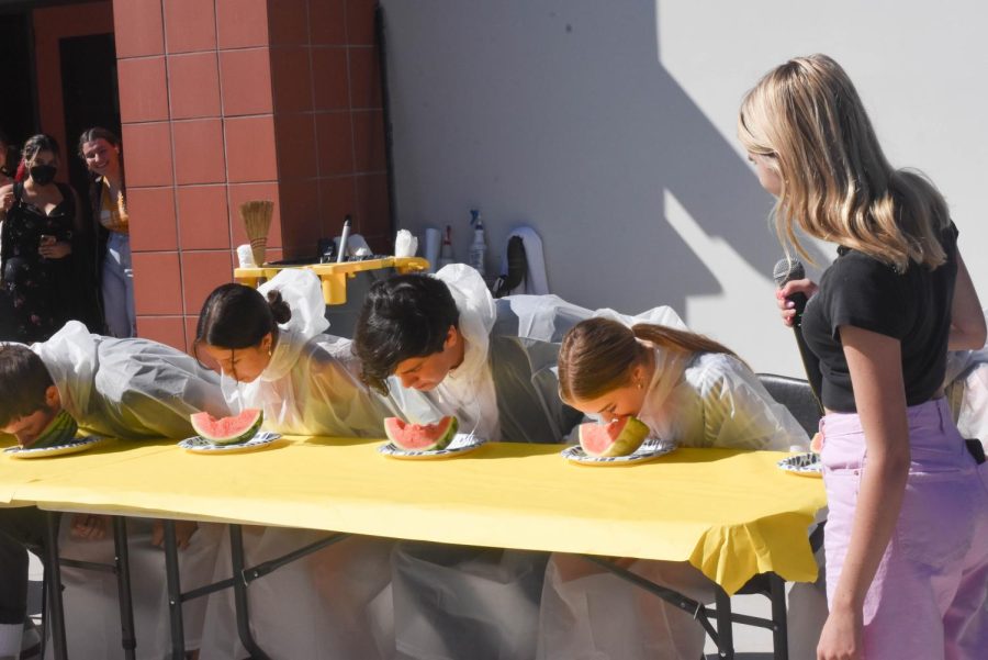 Junior Homecoming Court nominees participate in a watermelon eating contest during Tuesdays lunch activity.