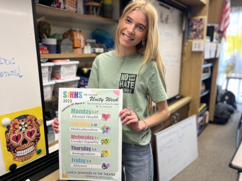 Member of the No Place For Hate organization, Paige Barclay (12) holds the Unity Week schedule, which shows the various topics like mental health, multiculturalism, gender diversity, immigration, and ableism that will be presented throughout the week. This year, members worked collaboratively towards the common goal of making a positive difference in their community. “It took a lot of creativity, a lot of teenwork, just a lot of little details that had to go into it to be perfect. A lot of things like the titles, theres a lot of key terms, a lot of communication with the principal, as well as with the guest speaker, said No Place For Hate Adviser Fernanda Villalba. I would hope that other people would still want to learn about other people on campus and their perspective and reality and how to just understand them better. 