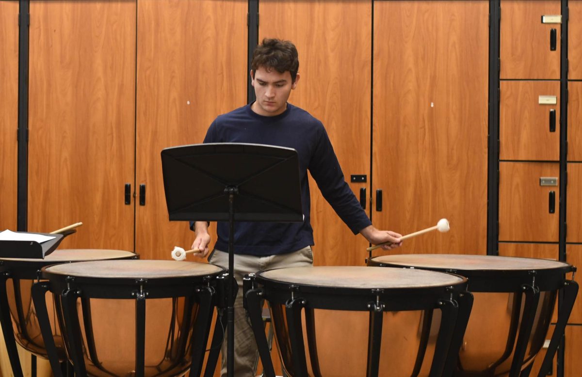 Playing+on+the+timpani%2C+Lucas+Patton+%2812%29+practices+his+percussion+piece.+Members+of+percussion%2C+like+Patton%2C+play+various+instruments+and+cooperate+together+to+steady+the+rhythm+of+the+music.+