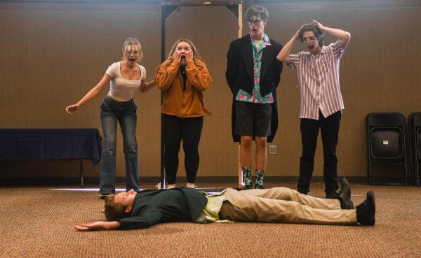 Theater students Viola Whittaker, Sydney Briggs, Liam Herd, Jacob Koclanis, and Luke Dunphy are rehearsing a scene for upcoming musical, Clue, where a chandelier falls and crushes Mr. Green. Just like former and future musicals, Clue was chosen by theater arts instructor Cambria Graff.