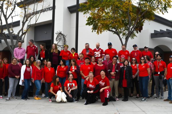 Teachers gather in the upper quad on Wednesday wearing red in support of the CUEA negotiations team. The teachers are seeking a share of the 8.22% cost of living adjustment (COLA) they must bargain for with the Capistrano Unified School District. CUEA stands for Capistrano Unified Education Association.