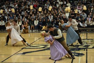 Rapunzel, Hannah McCabe (12), and Flynn Rider, Jake Javorsky (12), perform a dip in the final moments of the Dance team’s performance for the Rapunzel themed pep rally. Background dancers Weston Port (11), Summer Lewis (12), Cooper Javorsky (10), and Savannah Stall (12) accompany. This scene resembles the floating lanterns scene in the movie, where Flynn and Rapunzel finally embrace each other.