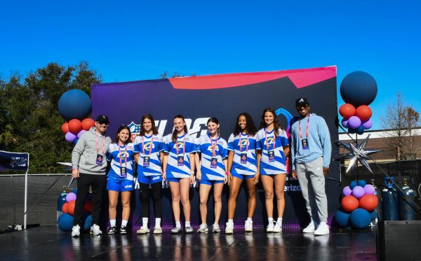 South OC Wave 17u girls team smiles as they were honored on stage in Orlando, Florida. The team has four players from San Juan Hills, one player from Trabuco Hills, and one player from Mission Viejo High School all coming together to represent the Los Angeles Rams. 

