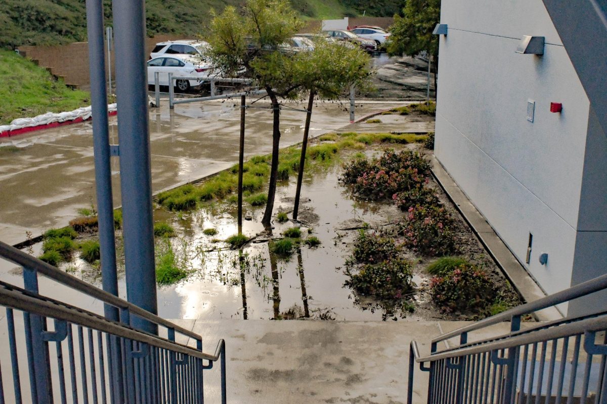 After several days of rain, J-Building is flooded with excess rain water. With only three months out of the year containing rain, San Juan Hills High School wasn’t built to deal with a lot of water. After only a few days of arguably light rain, the lack of drainage in the J-Building planters leaves the water with nowhere to go but out and over the sidewalk.