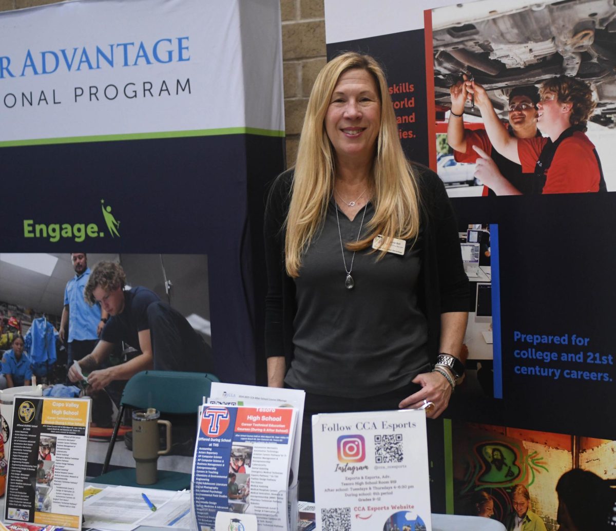 Guidance+Specialist+Lynne+Bell+distributes+helpful+information+at+the+College+and+Career+Advantage+booth+at+the+career+fair+held+at+San+Juan+Hills+High+School+on+March+18%2C+2024.