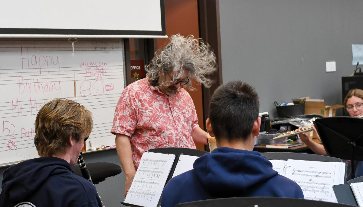 The morning after Concert Band’s successful performance, music Director Dean McElroy head bangs in celebration of his students success at their concert.