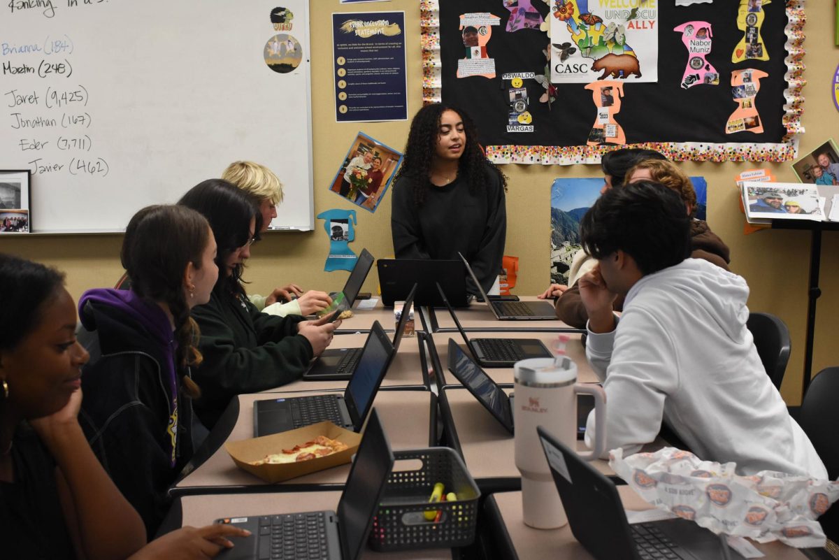 During a No Place For Hate meeting, Joelle Al Ammar (11) prepares with her group for Unity Week. They created a slideshow presentation to raise awareness for mental health to inform Stallions.
