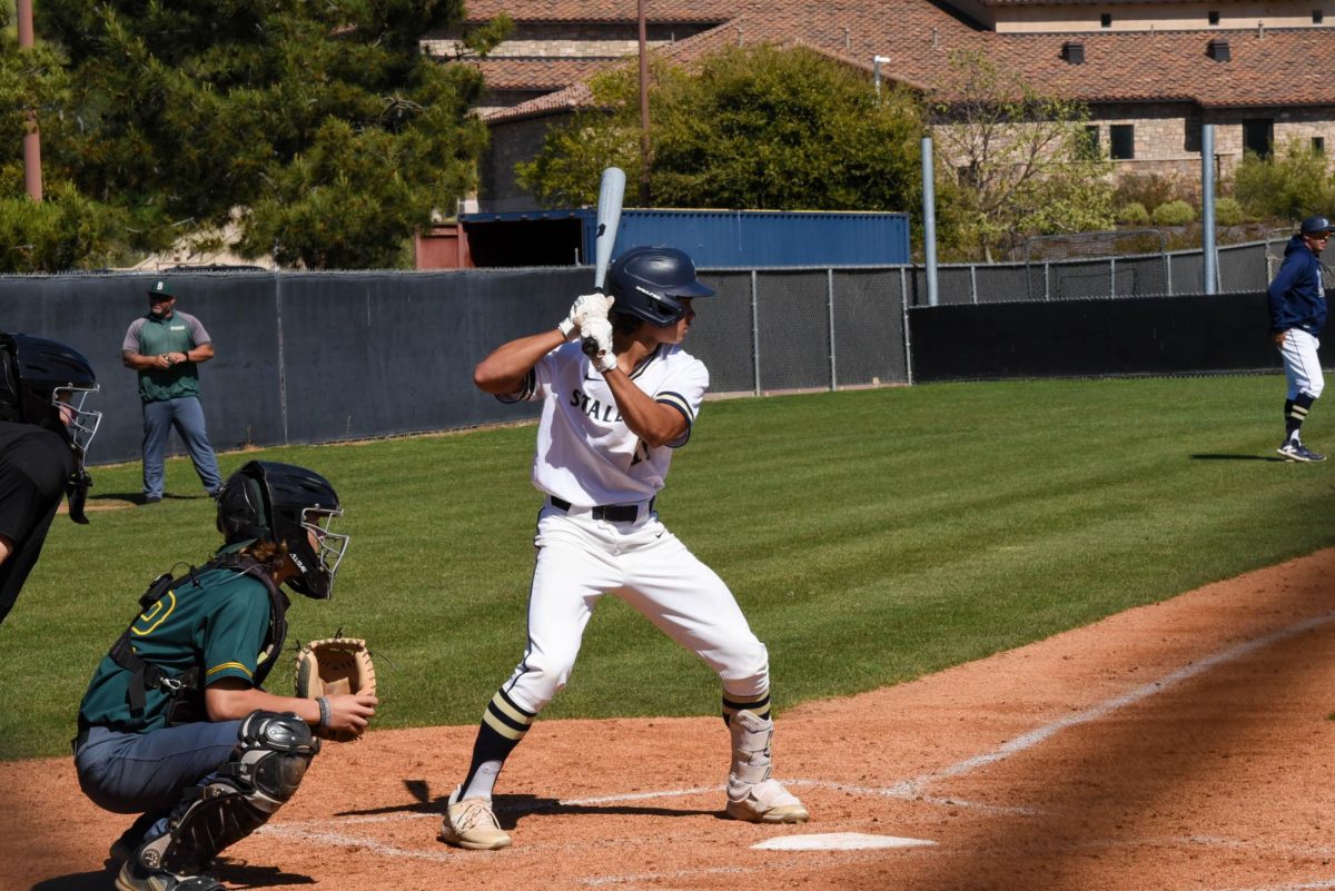 Colbie Corpuz (11) stands in the batters box ready to swing his bat during a game against Brea Olinda on Monday April 15. They pulled off a great win with a final score of 11-4. Later in the week, for the first time in the history of SJHHS, the team won league championships.