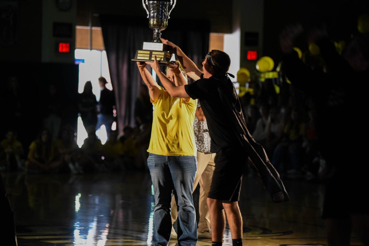 As the senior class wins Clash of the Classes for another year, Mrs. Magaña and Carson De Filipo (12) hold the trophy, commemorating the exciting win. Winning Clash of the Classes is an honor because it recognizes the classes school spirit and camaraderie.