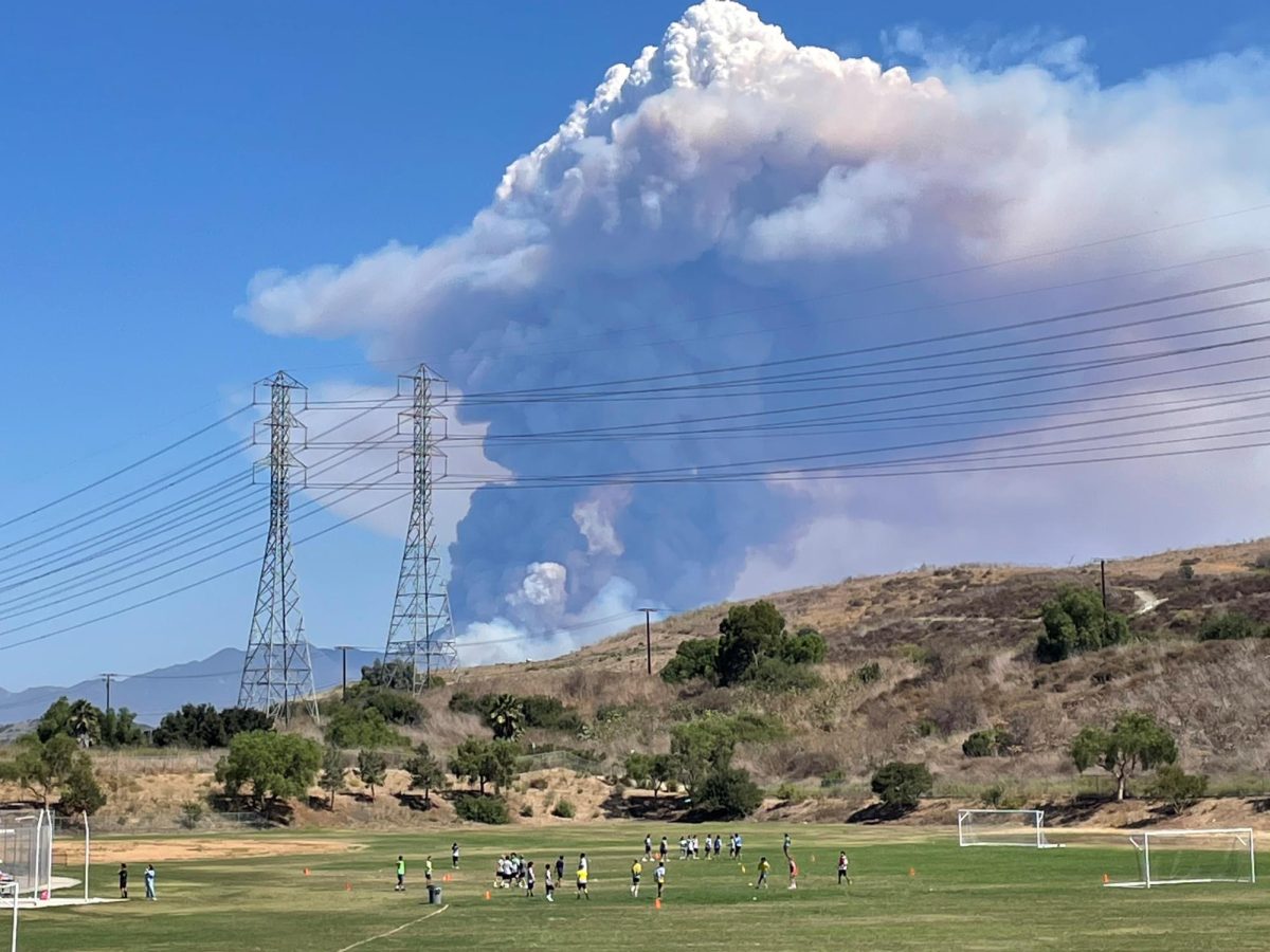 An enormous pyrocumulus cloud formed over the Airport Fire while students in P.E. endured scorching heat on the practice field on Sept. 9. Pyrocumulus clouds occur when hot air from a fire causes moisture in the air to condense, forming a cloud. Sometimes these clouds can create their own weather conditions including lighting.