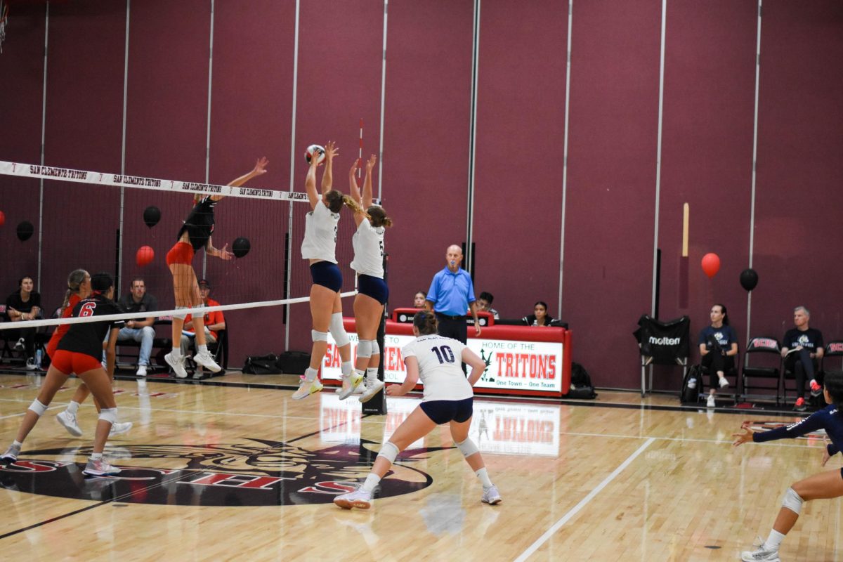 SJHHS Girls Volleyball faces off against the San Clemente High School Tritons. Senior volleyball players #3 Whitney Port (10), #5 Addie Fuller (12), and #10 Sydney Hanson (12) block their opponents. With all their efforts, they successfully defeated SCHS with a final score of 3-1.