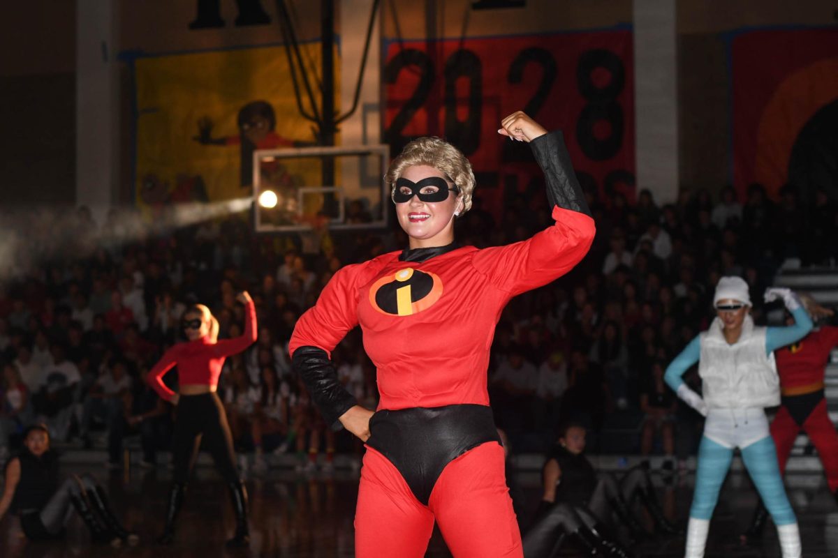 Starring as Mr. Incredible in the Homecoming pep rally, Advanced Team dancer Haven Warther (11) shows off her talent.
