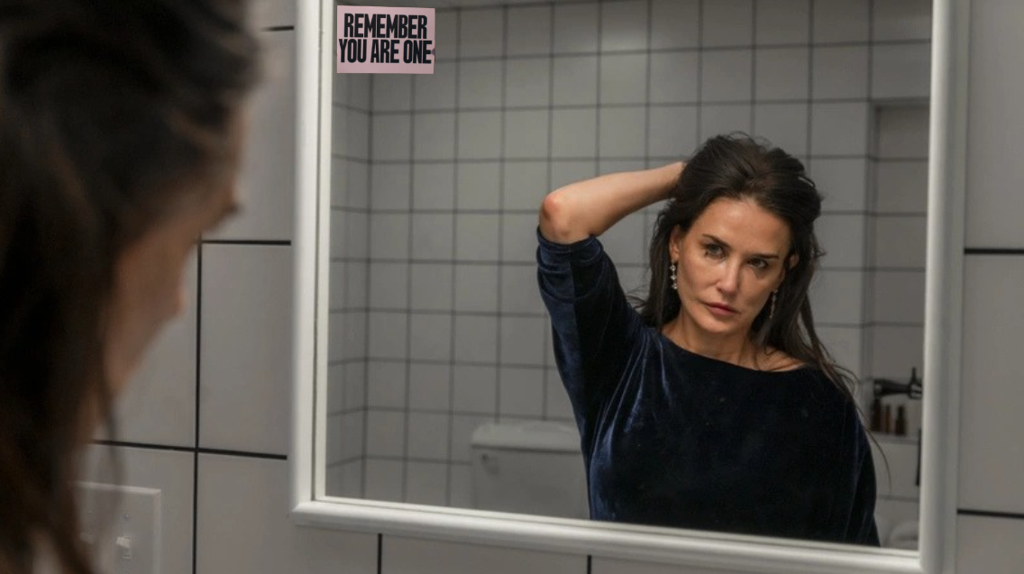 Elisabeth Sparkle (Demi Moore) decides to take “The Substance”, a cell-replicating serum that literally creates a better and younger version of herself, because she is no longer appreciated in the industry due to her age. “REMEMBER YOU ARE ONE” represents the repeated phrase for Sparkle and her replicated self that developed this biological horror film. 