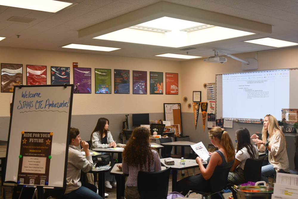 Connecting with her students, Teacher Lynee Bell meets with a select group of students who are part of the CTE Ambassadors program. The meeting included discussions about future volunteering plans for the upcoming school year. Students got the opportunity to meet and connect with their fellow peers as well.