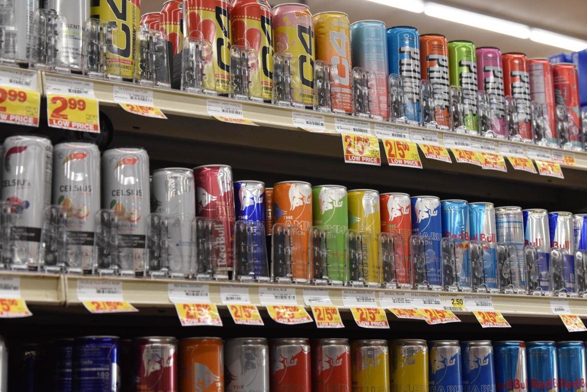 KICKING IN: Photo depicts the variety of energy drinks a person may consume. The drinks come in multiple flavors and colors peeking one’s interest, making it desirable. Students often rely on these drinks to help them through the day in order to stay on task and focus at school. Photo by Sydney Hogancamp