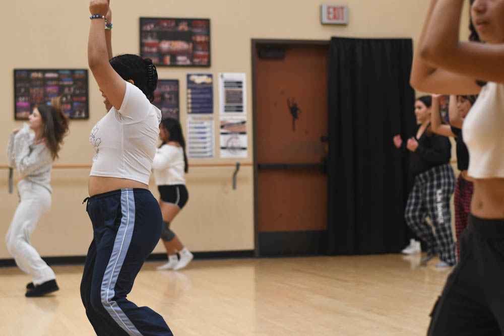 Students in the period 4 dance class are taking turns rehearsing. Preparing themselves for a balanced and thoughtful performance. Some of the students dedicate their time to dance during lunch and after school. 