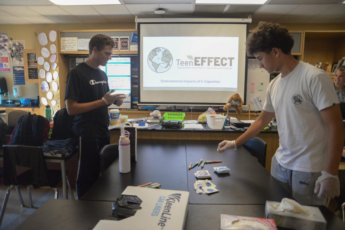 Daniel Albuquerque (12) and Santiago Fausto (10) prepare for the campus cleanup. The event took place from 3:30-4:30pm where participants walked around school, picking up trash that could potentially end up in the ocean.