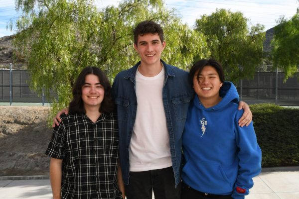 Posing with big smiles, liberal Elliot Ruvalcalba (12), moderate Ben Dart (12), and conservative Jason Studdert (12) positively coexist despite their differing political ideologies. Each of these students are among the few seniors who can vote in the upcoming election.