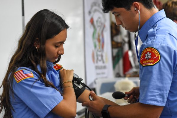 The students at the college and career advantage training center document and research each other. They work together as a part of the training to prepare them for working on real patients. 
