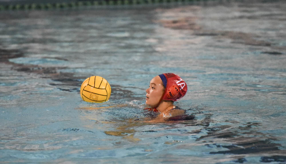 Stallions are victorious against Santa Margarita with the score of a11-10. Malia Marumoto glides through the water to retrieve the ball. 