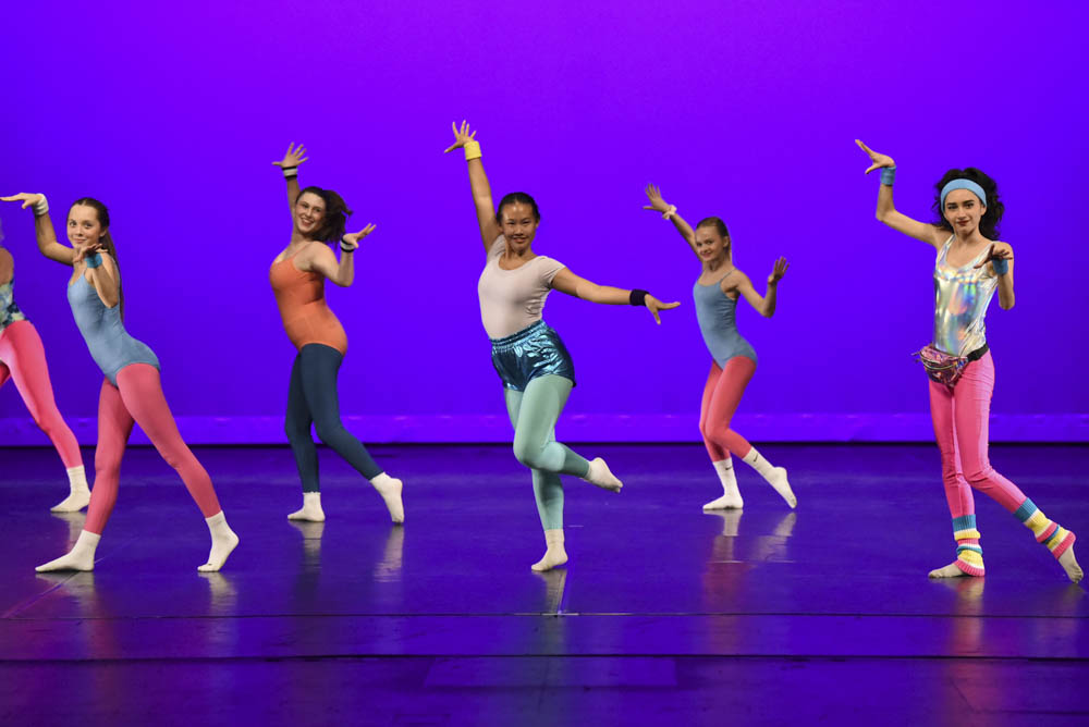 San Juan Hills High School's dance team took the audience back to the 80’s when performing an upbeat and nostalgic induced routine. From left to right students, Hudson Young, Meghan Clatfelter, Madelyn Hui, Lola Earnest, and  Sophia Severson are dancing in an old-fashioned manner while styling in colorful leotards and yoga pants.  