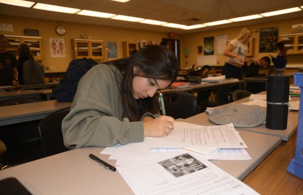 Hard at work, AP Biology student Iclia Rodriguez (12) finishes up her Unit five “Drosophila Genetics lab.” Unit five is centered on the study of heredity, and this lab focused on the genetics of fruit flies through an online simulation. 
