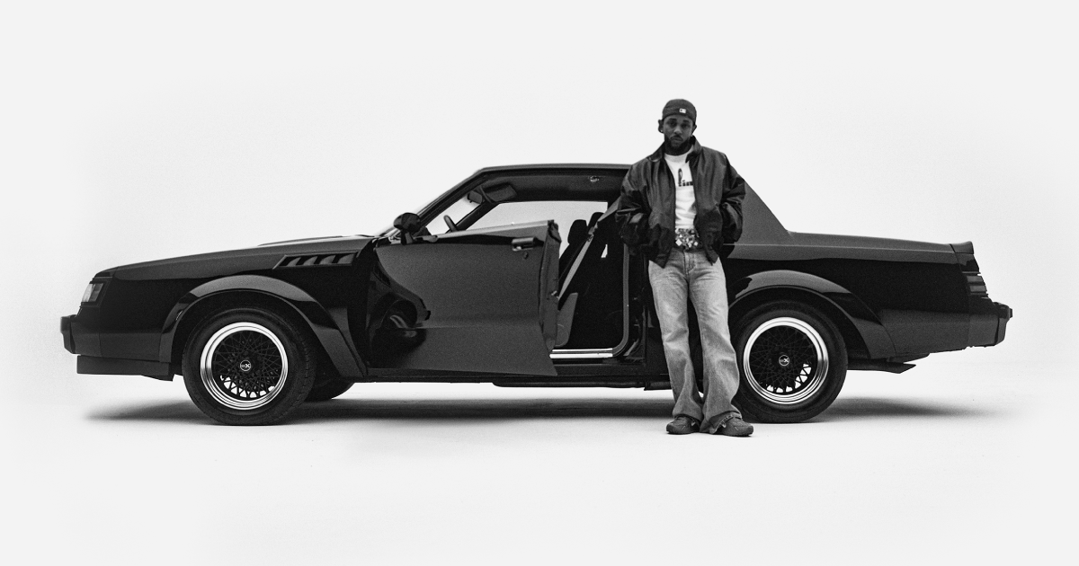 Kendrick Lamar stands in front of a vintage 1987 Buick Grand National Experimental (GNX), the namesake of the album itself. Lamar purchased the limited-run vehicle as a commemoration of the fact that it was the same model of car that his father drove him home from the hospital in following his birth. (Photo courtesy of PGLang)