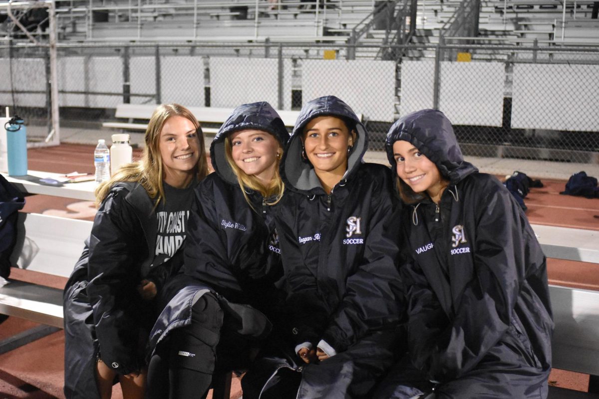 Beginning from left to right, Adelyn Clifton (10), Skylie Willis (10), Reagan Rigol (10), and Addy Vaught (11), smile as they begin their winter season. The girls soccer team had their home opener against Foothill, which ended in a 0-0 draw. 