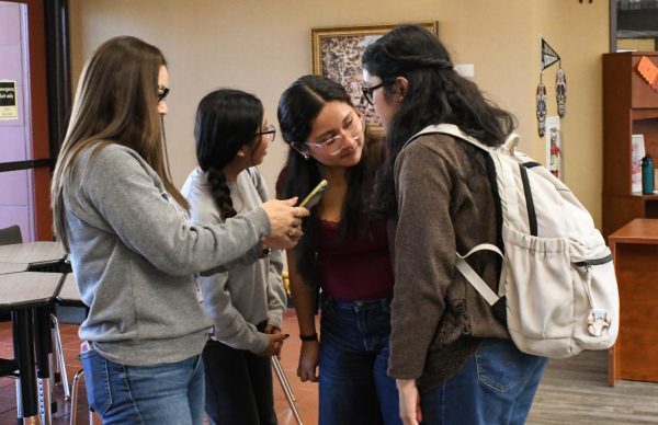 First gen students, ----- Mia Garcia (12), and Alezza Pineda (12) discus their ideas for a video they are creating with the help of ----. The First Gen students were asked to make short videos about their plans for the future to celebrate national First Gen day, which took place on November 8.