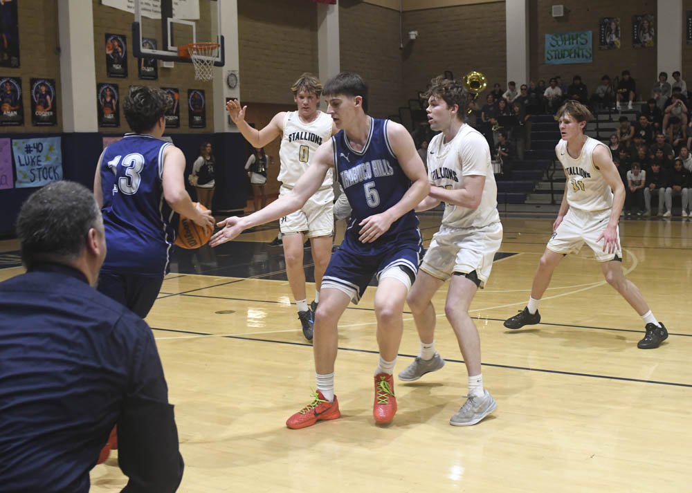 Jackson Tilden guards the opposing team member during the game. Stallions win against Trabuco Hills 57-47. 