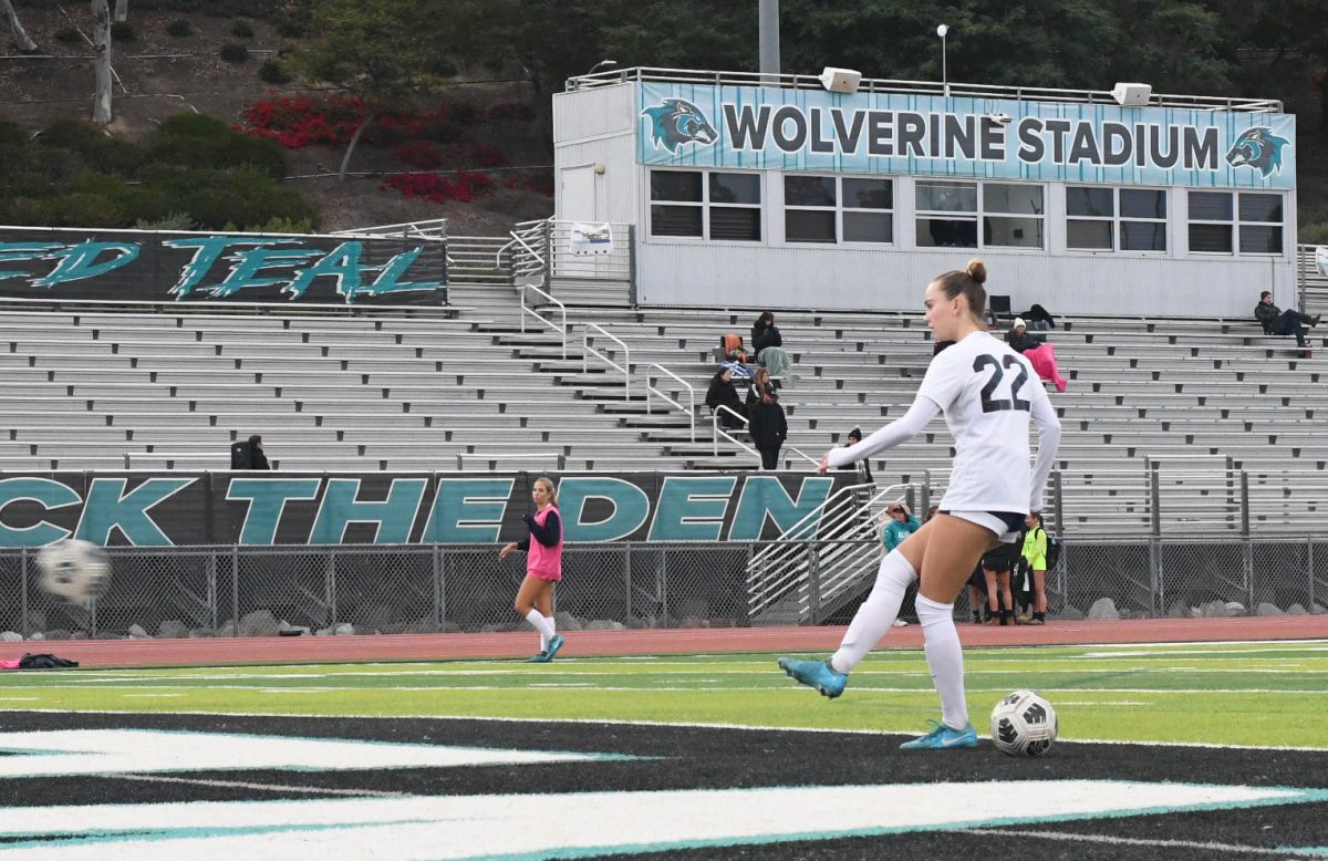 During warmups, Izzy Sawyers (12) scores a goal at her last high school league away game. The team tied 0-0 against Aliso Niguel High School during a well-matched game. Sawyers is now committed to the Univerity of Orgeon in which she will continue her soccer career at a D1 level college.