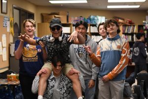 From left to right: Jackson Thurman (11), Daniel Riberos (11), Nathan Perlas (12), Kiyan Ghaffari (11), Kaden Banks (11), and Lucas Peña (11) smile together in their tacky tourist attire. On Wednesday 1/22, students dressed up in tourist-like clothing in the spirit for winter formal. 