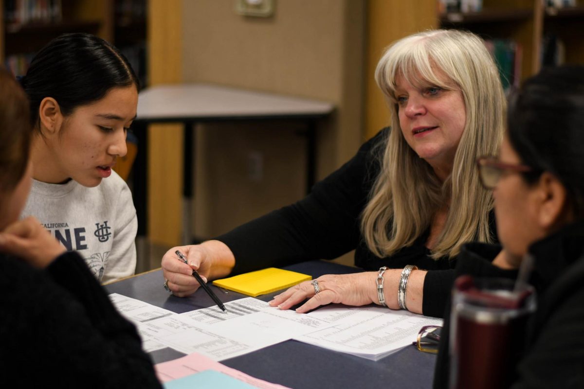 School Counselor, Maureen Scherf guides Spanish speaking families at the English Learners Advisory Committee (ELAC) meeting. The ELAC provides support to students and families with second language needs and informs them on the educational opportunities offered at SJHHS.