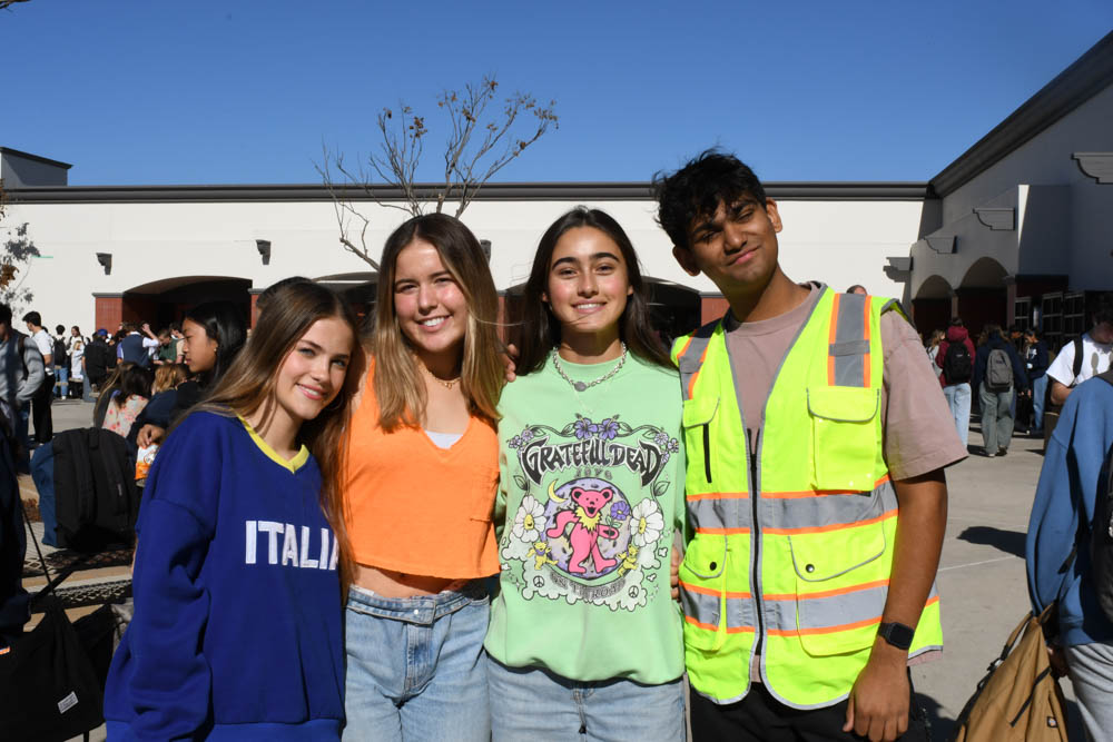 Students Chelsea Shady (10), Krissy Cucuk (10), Hope Khalili (10), and Sidharth Gaikwad (11) dress out in bright wear for La La land Winter Formal Spirit Week.