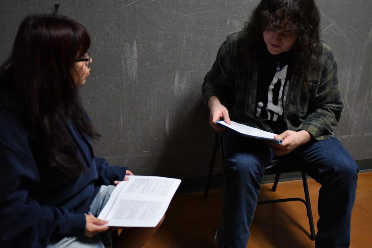 In F building hallway, Lynx Seja (11) and Mason Guell (11) rehearse lines for the play Children’s Hour.
